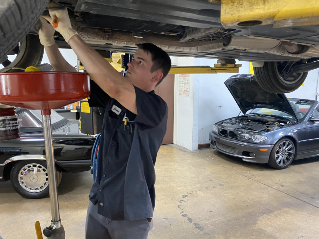 IMG_5695 shop mechanic performing an oil change